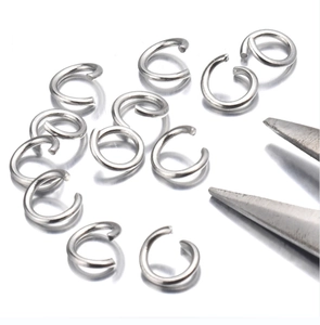 Macro shot of silver stainless steel jump rings for DIY jewelry making with jewelry pliers