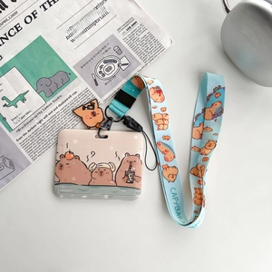 Detailed view of a cute Capybara ID card holder with long lanyard on a minimalist desk
