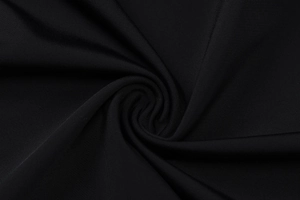 Close-up of black elastic V-neck tank top fabric showing smooth texture and woven detail