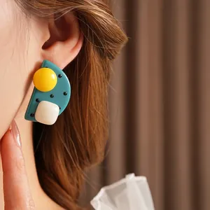 Polka dot geometric resin earrings with silver needles featuring pop art design styles