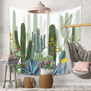 Detail of bohemian tapestry featuring hand-drawn desert cacti and floral illustrations