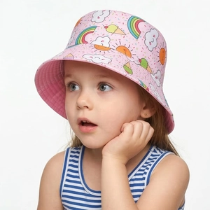 Detail of pink cotton sun hat featuring vibrant rainbow and cloud patterns for kids
