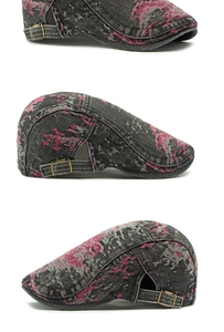 Detail view of washed denim beret featuring vintage floral prints and brass buckles