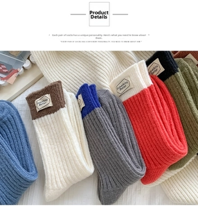 Detail showing thick knit wool socks with vertical stripes and stitched fabric labels