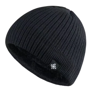 Detail view of winter beanie showing thick black knit texture and warm fleece lining