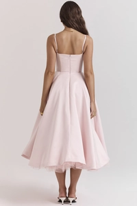 Detail of pink satin dress back featuring thin straps and hidden zipper closure