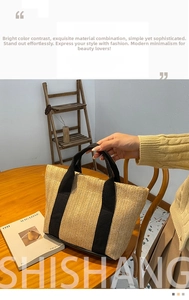 Detailed straw tote bag texture with wide black straps in a cozy cafe setting