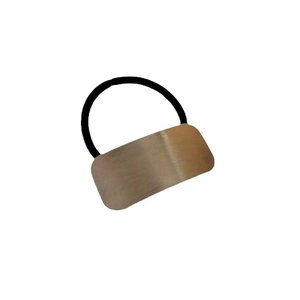 Minimalist elastic hair tie with brushed rectangular metal charm on white background