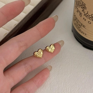 Chic 925 silver gold-plated heart bow stud earrings featuring textured metallic relief