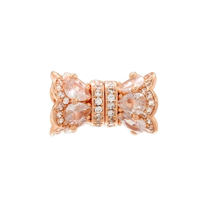 Close-up of rose gold bow bead with micro-pave white zircon for DIY jewelry making