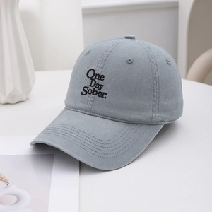 Detail of One Day Sober black embroidery on gray-blue twill cotton baseball cap