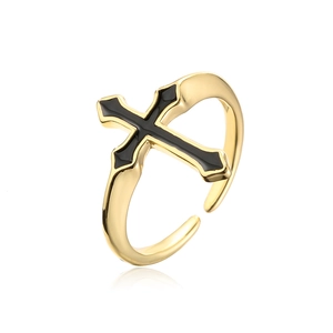 Macro view of adjustable gold cross ring with black enamel inlay and zircon detailing