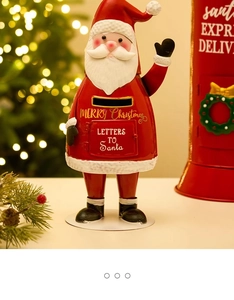 Festive red Santa Claus metal mailbox ornament with Merry Christmas lettering for holiday decor
