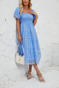 Detail of light blue tiered maxi dress with puff sleeves and smocked square neckline