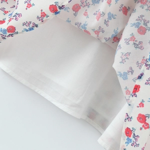 Floral embroidered halter mini dress with red and blue flowers and breathable white lining