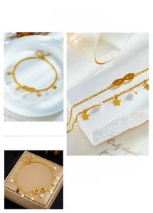 Detail of gold double-layered anklet with infinity symbol, stars, and white pearls
