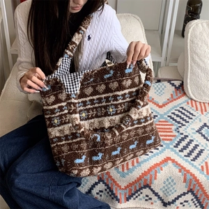 Macro view of plush tote bag showing bohemian patterns and classic checkered lining detail