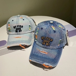 Vintage distressed denim baseball caps with NY embroidery in light and medium blue wash