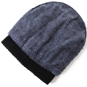 Men's winter knit beanie with thick gray faux fur lining and black ribbed cuff detail