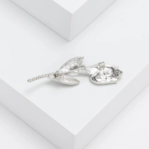 Vintage silver tulip brooch with textured metal finish and secure pin back design