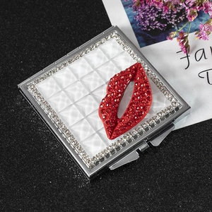 Square silver metal compact mirror with red crystal lip design and rhinestones
