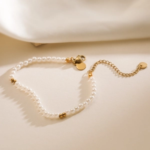 Elegant 18K gold plated stainless steel pearl bracelet with adjustable extension chain