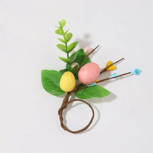 Detail of Easter napkin ring featuring speckled eggs and realistic eucalyptus foliage
