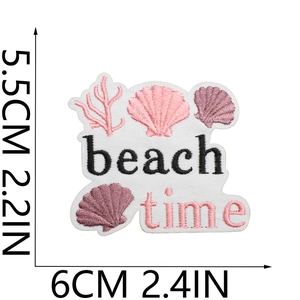 Detail of beach time shell embroidery patch with pink coral and measurement scales