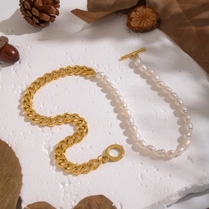 Detail of half golden chain and half natural freshwater pearl necklace with OT toggle clasp