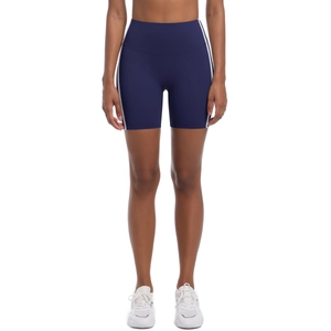 Detail of high-waisted navy blue yoga shorts with white side stripes and stretchy fabric