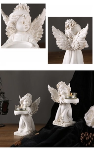 Detail of vintage angel candle holder with intricate resin relief and classical cherub design