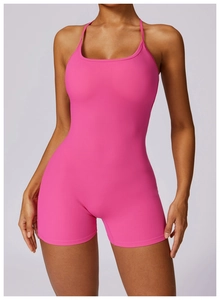 Detail of rose pink yoga bodysuit showing the thin straps and U-neckline design