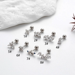 Set of 8 unique stainless steel stud earrings with cubic zirconia and ball-back design