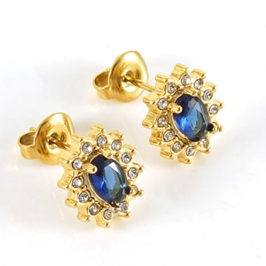 Golden sunflower earrings with deep blue oval gemstone and sparkling crystal halo
