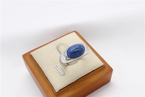 Detailed shot of oval lapis lazuli gemstone set in a silver-tone titanium steel ring