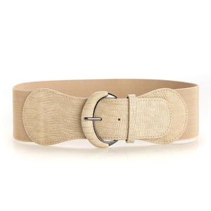 Detail of beige crocodile embossed leather and elastic belt with dark metal buckle