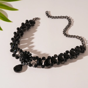 Detail of vintage layered black gemstone necklace with teardrop water-drop pendants