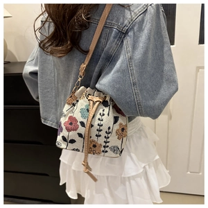 Ethnic style nylon bucket bag with floral jacquard drawstring and leather shoulder strap