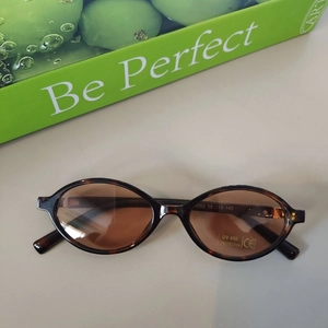 Detail of tortoise shell oval kids sunglasses with UV400 protection and CE certification