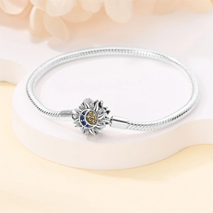 Silver snake chain bracelet with sun and moon charms and colorful zircon inlays