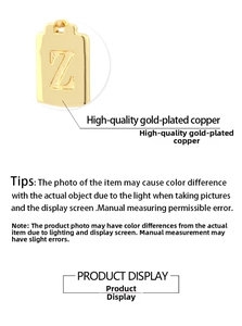 Macro detail of high-quality gold plated copper square pendant with embossed letter Z
