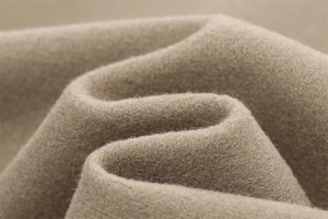 Macro shot of high-quality camel blend fabric texture with soft wool-like finish