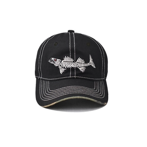 Close-up of white fishbone embroidery on a black cotton baseball cap with white stitching