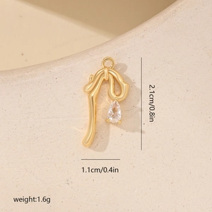 Detailed view of 2.1cm golden bow pendant with teardrop zircon and size specifications