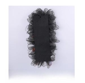 Detail view of the Halloween wreath's black mesh back with hanging hole and sturdy backing