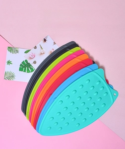 Detailed view of colorful heat-resistant silicone iron rest pads with non-slip texture