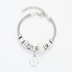 Silver snake chain charm bracelet with white flower pendant and pearl beads on white background