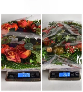 Detailed view showing the weight measurements for autumn pumpkin wreaths on a scale
