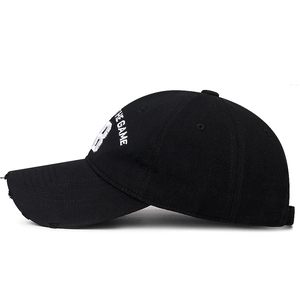 Black cotton baseball cap with number 28 embroidery and vintage distressed brim detail