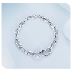Detail shot of the chunky S925 sterling silver chain bracelet with double heart link closure